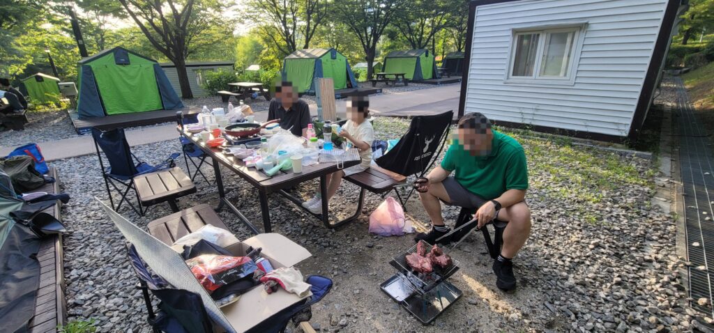 View of the table next to the tent and meal preparation