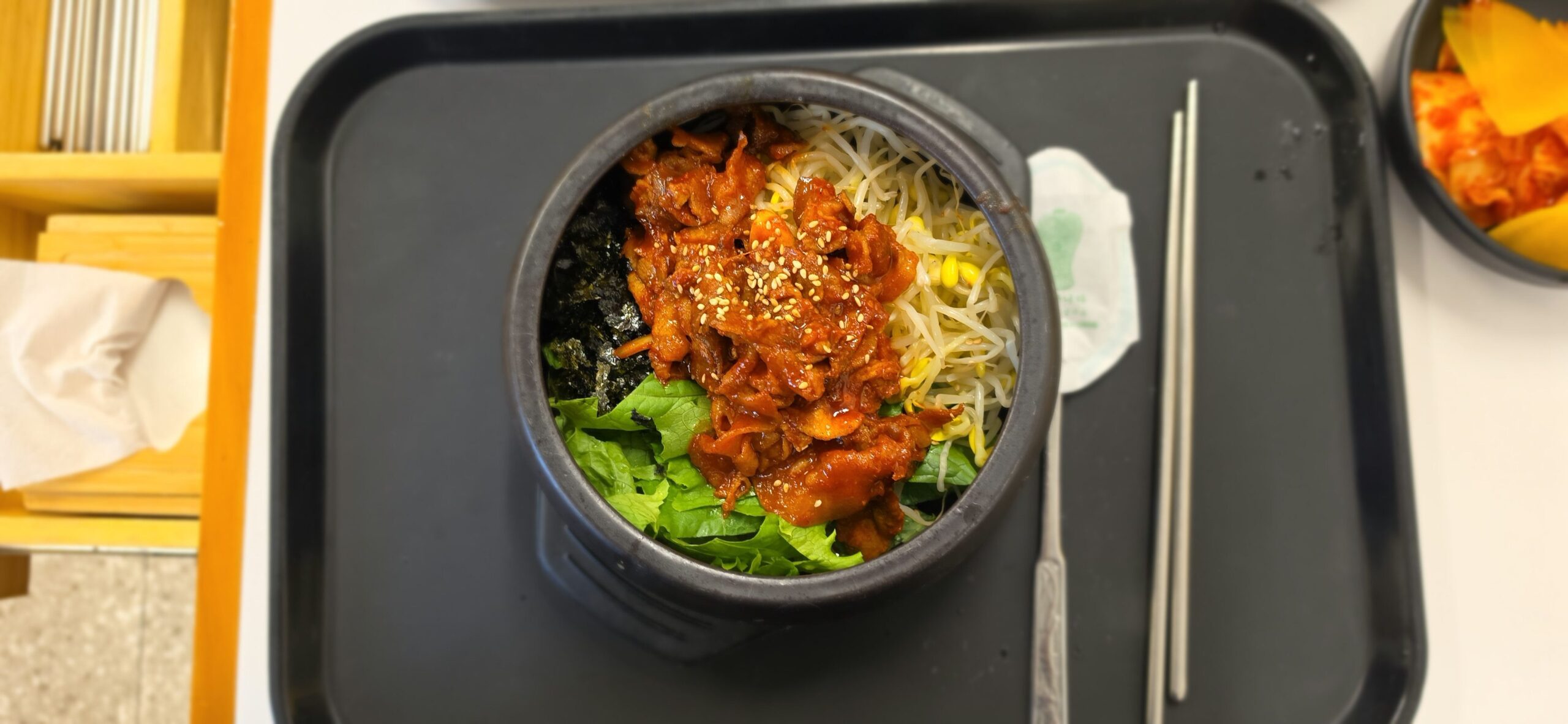 Korean-style spicy pork bibimbap in a stone pot