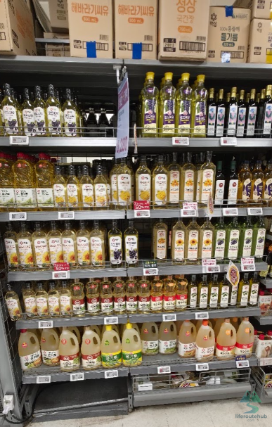 Korean Grocery Store 101: How to Shop at E-mart in South Korea Cooking oil and canola oil on the shelves of E-mart stores